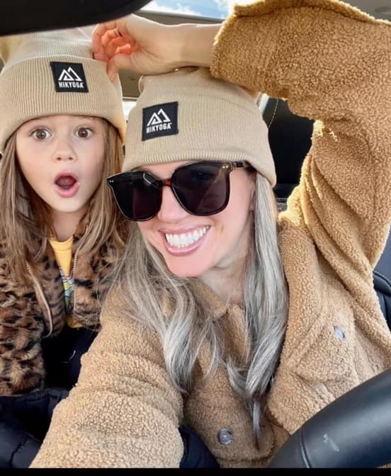 Mother and daughter car selfie in matching Hikyoga beanies