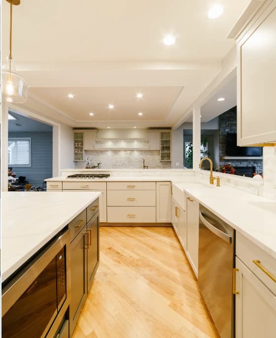 Bright white kitchen remodel with gold hardware